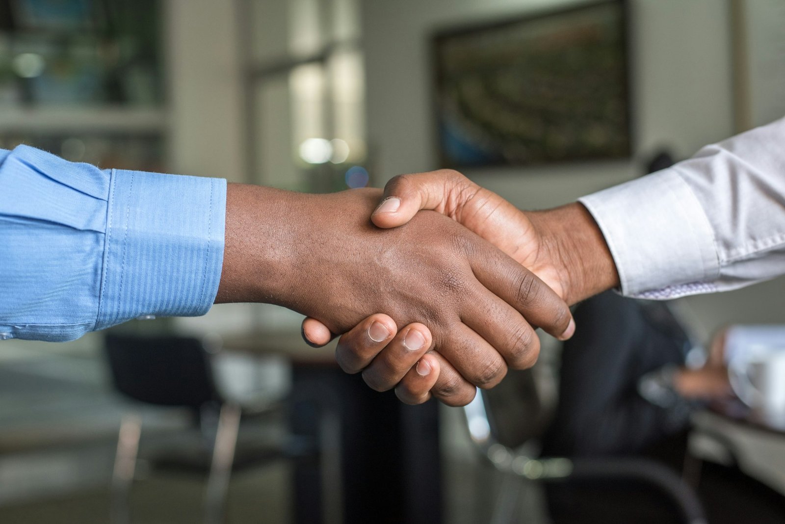 AxarBiz partnership handshake